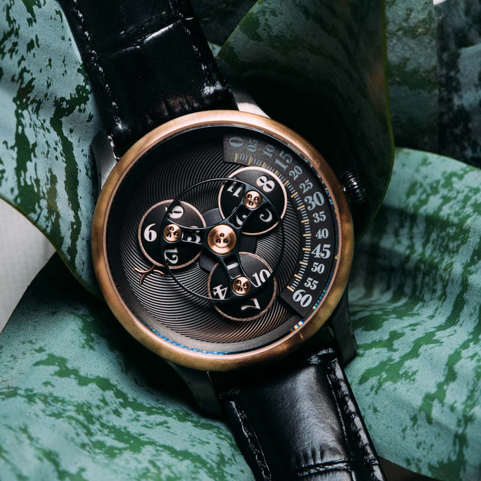 Xeric Triptych Automatic Wandering Hour Gunmetal Rose Gold angled shot picture