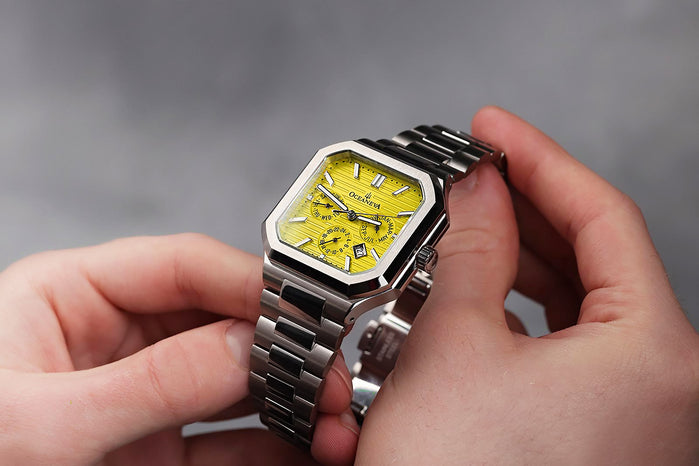 Oceaneva Tenuis Automatic Thin Calendar Yellow angled shot picture